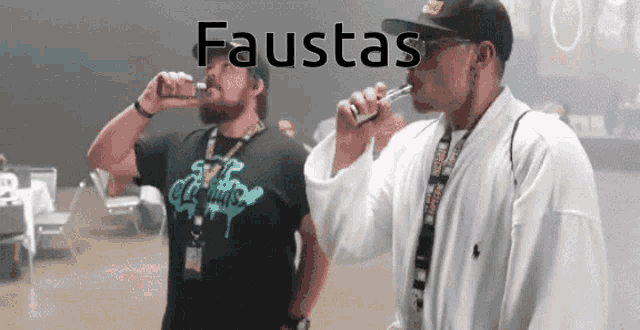 two men smoking electronic cigarettes with the word faustas written above them