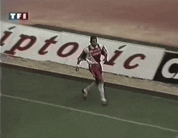 a soccer player is running on a field in front of a sign that says " iptonic "