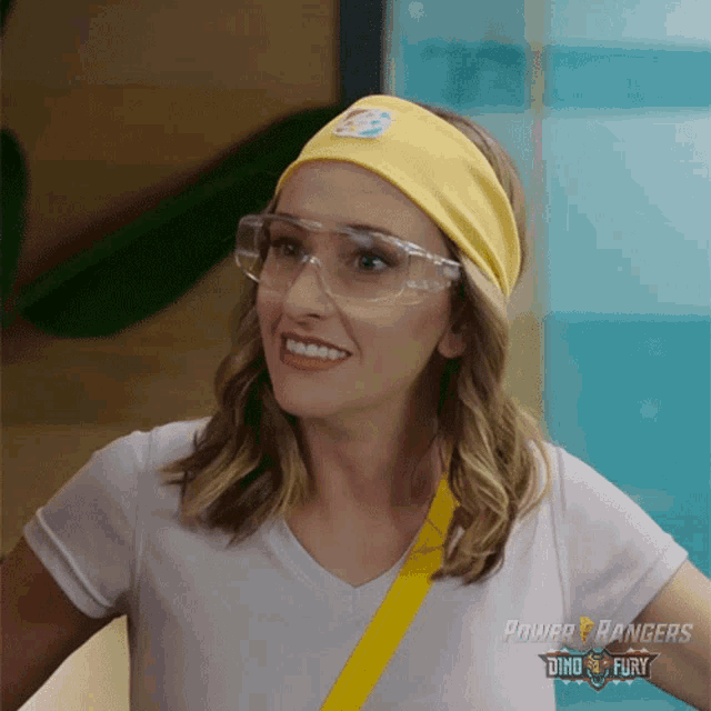 a woman wearing glasses and a headband with the power rangers logo