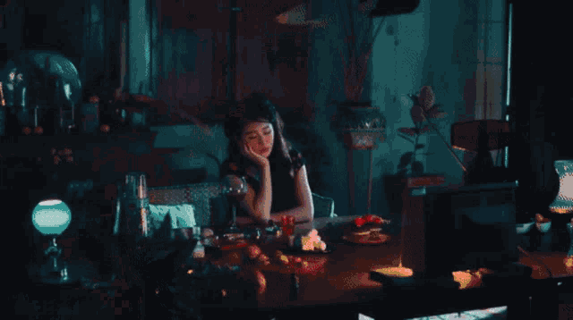 a woman peeking out from behind a pillow with hearts around her