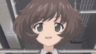 a close up of a girl 's face with a smile on her face