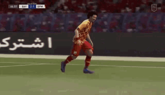 a soccer player is laying on the field during a game