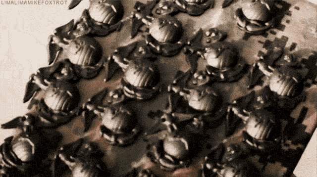 a close up of a bunch of metal objects with the name linalimamikefoxtrot on the bottom right