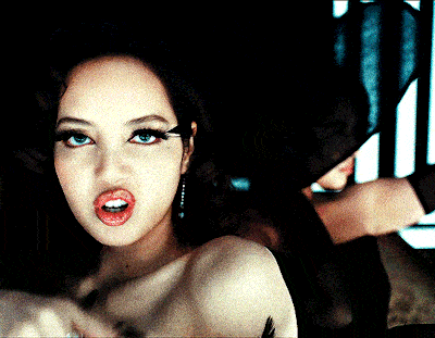 a close up of a woman with red lips