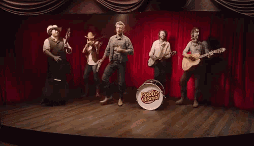 a pepto bismol band performs on stage
