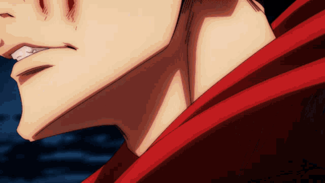 a close up of a man 's face with a red hoodie on