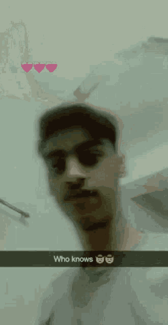 a man wearing sunglasses and a hat is taking a selfie with a caption that says who knows .
