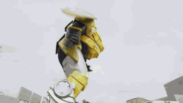 a robot is flying through the air with a green light coming out of it 's mouth .