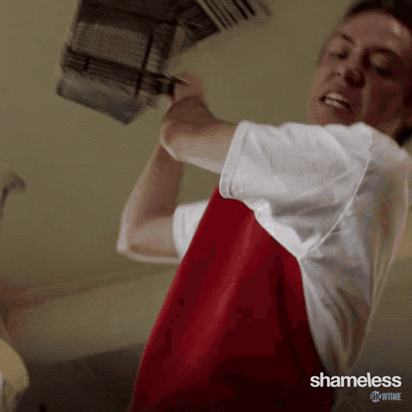 a man in a red and white shirt with shameless showtime written on the bottom of his shirt