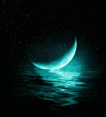 a crescent moon is reflected in a body of water