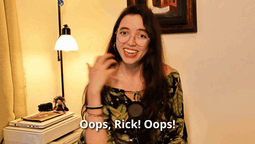 a woman says oops rick oops in front of a laptop