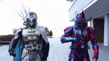 two kamen riders are standing in front of a building