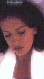 a close up of a woman 's face with a search bar at the top