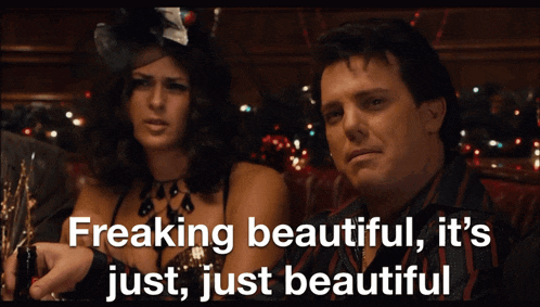a man and a woman are sitting next to each other and the man says " freaking beautiful "