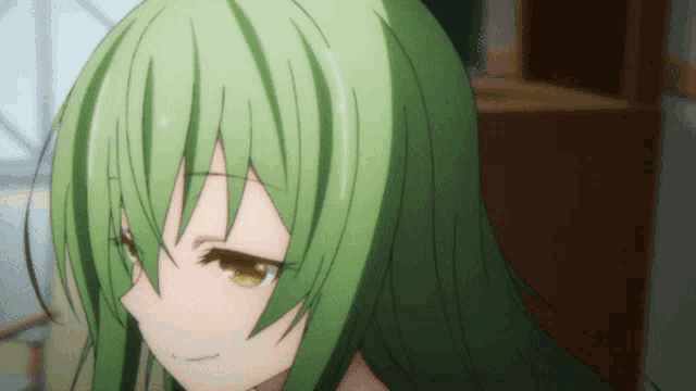 a close up of a girl 's face with green hair and yellow eyes