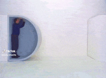 two men are standing on a small table and one of them is walking