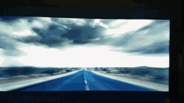 a painting of a road with a cloudy sky behind it