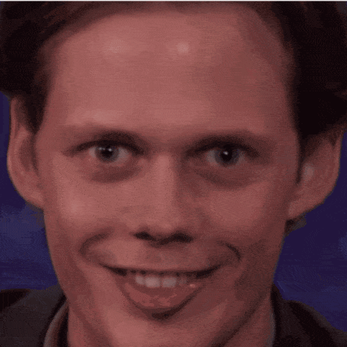 a close up of a man making a funny face