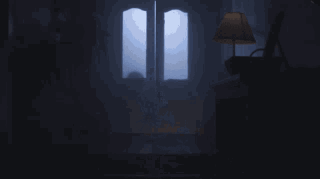 a lamp is lit up in a dark room with smoke coming out of the doorway