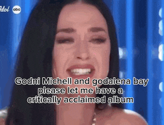 a woman is smiling and crying while talking about godni michell and godalene bay .
