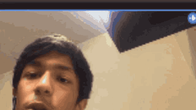 a close up of a man 's face with a blurred background