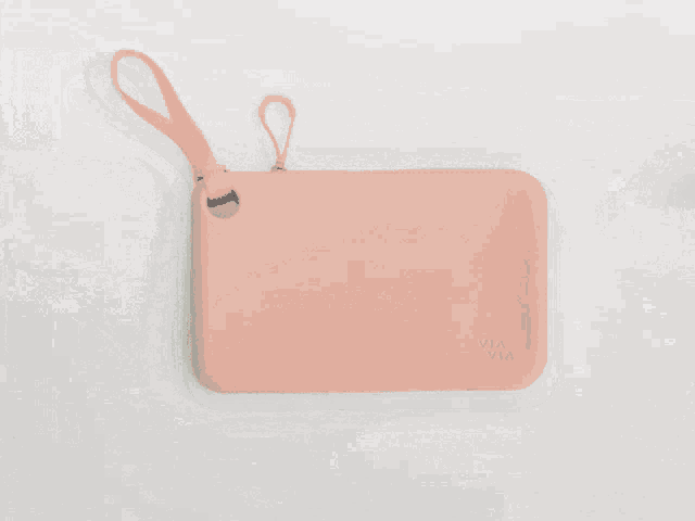a gray via via purse with a handle