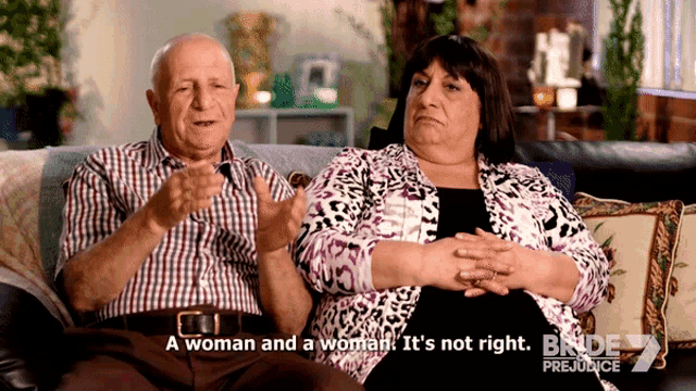 a man and a woman are sitting on a couch and the woman says " a woman and a woman it 's not right