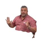 a man with a beard is wearing a pink shirt and giving a thumbs up .