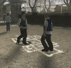 two men are playing hopscotch on a dirt field