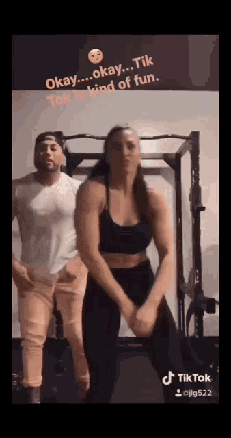 a man and a woman are dancing in a gym and the caption says " okay ... okay ... tik tok is kind of fun "