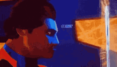a close up of a man 's face with a blue mask on .