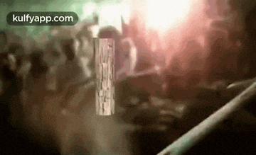 a crowd of people are dancing at a party in a club .