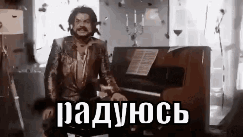 a man is sitting in front of a piano in a room with bullets falling around him .