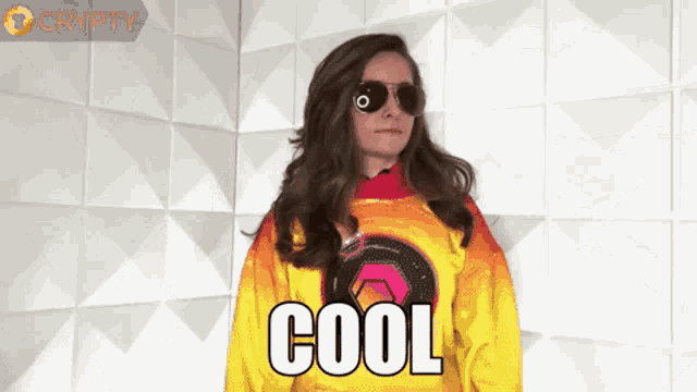 a woman wearing sunglasses and a sweater that says cool on it
