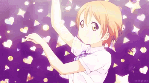 a girl is standing in front of a purple background with hearts and stars .