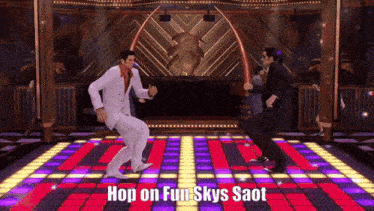 two men are dancing on a dance floor with the words hop on fun skys saot above them