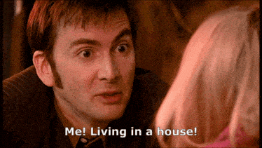 a man talking to a woman with the words me living in a house below him