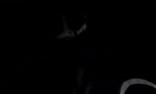 a black and white photo of a person 's face with their tongue sticking out