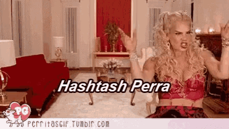 a woman is standing in a living room with the words hashtag perra on the bottom