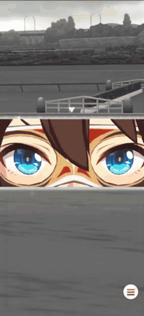 a close up of a person 's eyes with a white circle below them