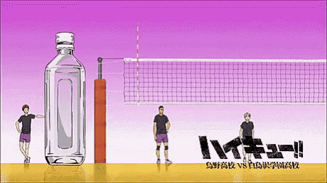 a volleyball game is being played with a bottle of water