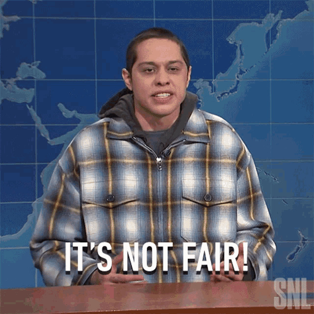 a man wearing a plaid jacket says it 's not fair