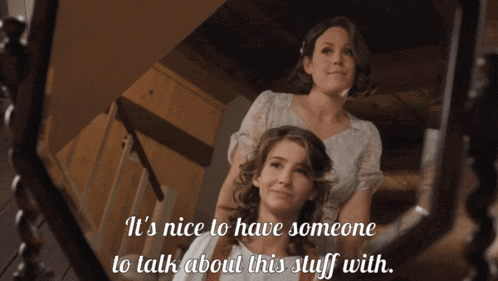two women are looking at themselves in a mirror with the words it 's nice to have someone to talk about this stuff with