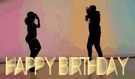 a man and a woman are dancing in front of the word happy birthday