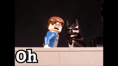 a lego batman and a lego man are standing next to each other with the words oh my written on the bottom