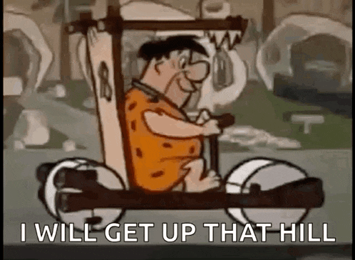 a cartoon character is driving a car with the words `` i will get up that hill '' written on it .