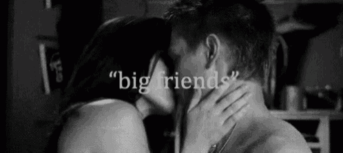 a man and a woman are kissing in a black and white photo with the words `` big friends '' .
