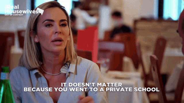 a woman sitting at a table with the words " it does n't matter because you went to a private school " below her