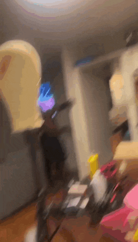 a blurry photo of a person standing in a room