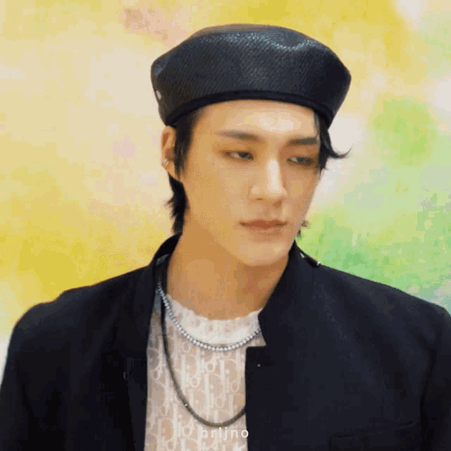 a close up of a man wearing a black hat